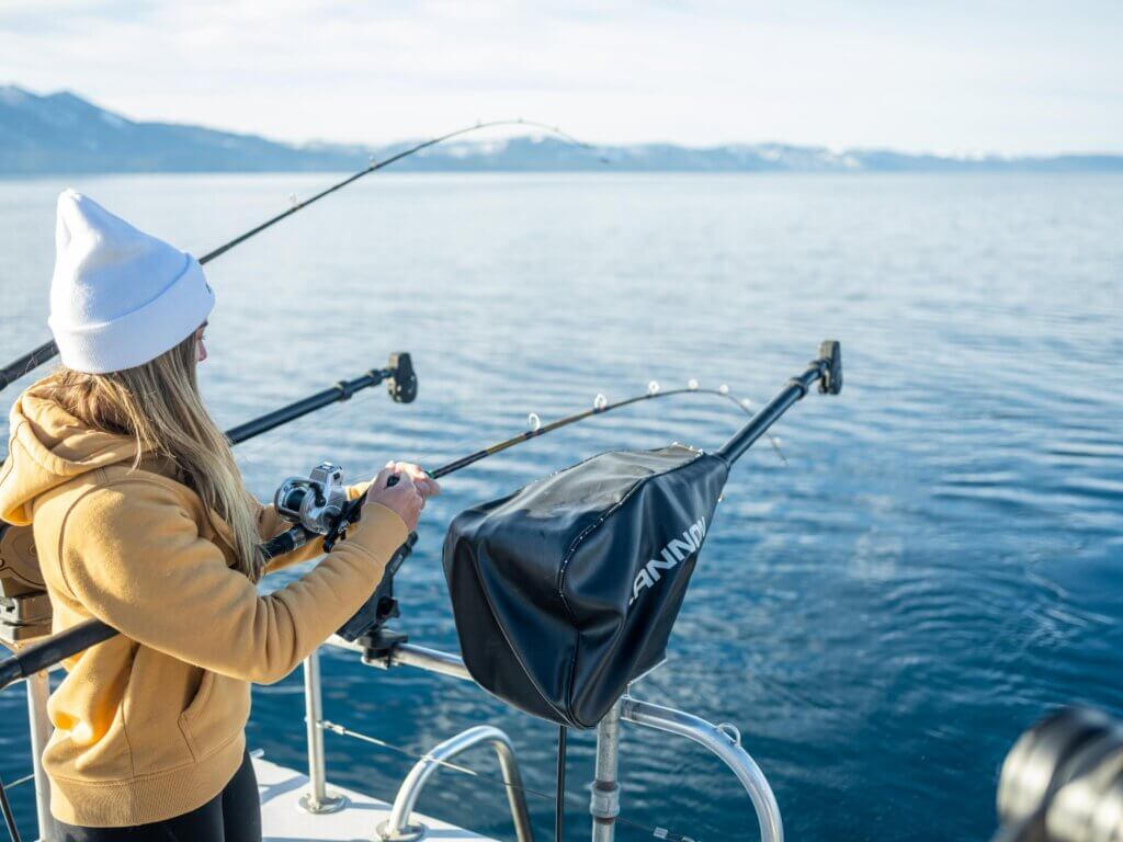 woman fishing on lake tahoe with a fishing charter